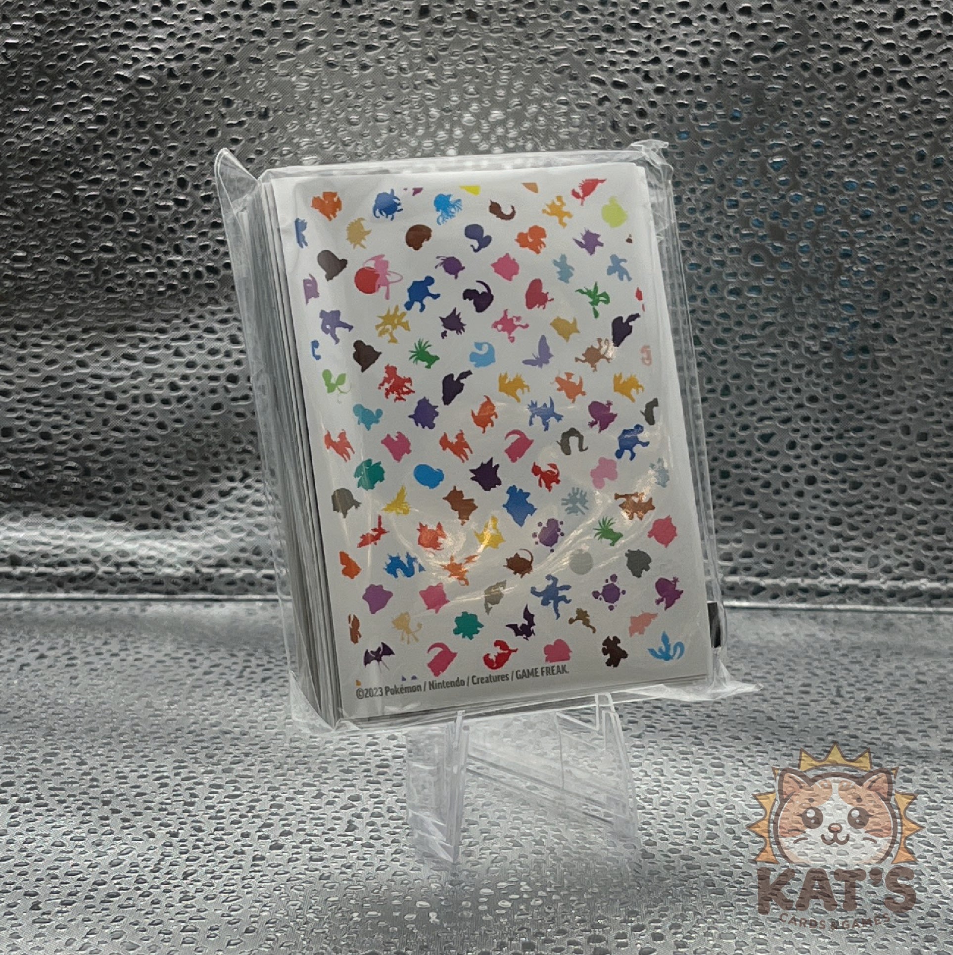 polka dot rainbow pattern sleeve with silhouettes of original pokemon from the scarlet and violet 151 set on a white background and soft touch texture