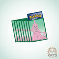 A fan of green Pokémon trading card sleeves with a pink character illustration on the front, shown on a light gray background. A Pokémon logo is visible on the top card, and a 'Kat's Cards & Games' watermark appears in the bottom right corner.
