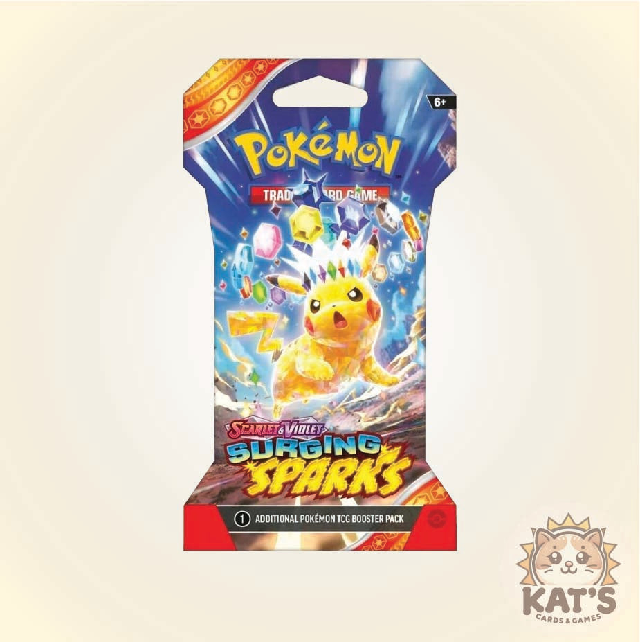 Pokémon Trading Card Game 'Surging Sparks' booster pack shown upright on a light beige background, with Pikachu artwork and the Pokémon logo visible. A Kat's Karabás Games logo appears in the bottom-right corner.